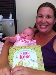 https://whimsicalworldbooks.com/wp-content/gallery/bookexploring-the-garden-with-the-little-rose/Delaney_with_ETG_book.jpg?t=1565644170